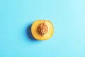 Half of fresh sweet peach on color background Royalty Free Stock Photo