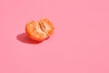 Half of grapefruit citrus fruit isolated on pink Royalty Free Stock Photo