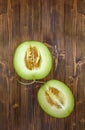 Half of green cantaloupe melon with seeds. Royalty Free Stock Photo