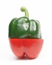 Half, the green sweet pepper, put on half of red s Royalty Free Stock Photo