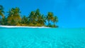 HALF IN HALF OUT Stunning shot of calm ocean surface and idyllic tropical island Royalty Free Stock Photo