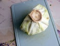 Half head of cabbage on plastic cutting board Royalty Free Stock Photo