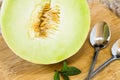 Half Honeydew Melon With Spoons Royalty Free Stock Photo