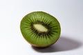 Half juicy green kiwi lies on a white background