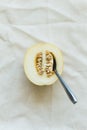 Half of juicy melon berries on a light natural tablecloth Royalty Free Stock Photo