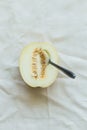 Half of juicy melon berries on a light natural tablecloth Royalty Free Stock Photo