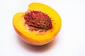 Half juicy peach with a stone Royalty Free Stock Photo