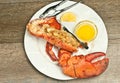 Half, large, streamed lobster stuffed with bread crumbs and scallops