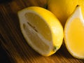 Half of a lemon macro. Juicy tropical fruit on a dark background