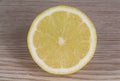 Half lemon on wooden background Royalty Free Stock Photo