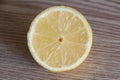 Half lemon on wooden background Royalty Free Stock Photo