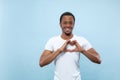 Half-length close up portrait of young man on blue background. Royalty Free Stock Photo