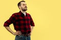 Half-length close up portrait of young man on yellow background. Royalty Free Stock Photo