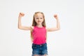 Half-length portrait of beautiful little girl in casual clothes posing isolated on white studio background. Happy Royalty Free Stock Photo