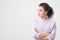 Half-length portrait of beautiful woman wearing white blouse looking aside. Royalty Free Stock Photo