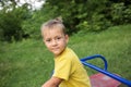 Half-length portrait of a cute preschooler boy 5 - 6 years old in a yellow t-shirt Royalty Free Stock Photo