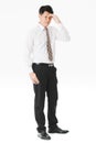 Half-length portrait of middle aged, handsome, Asian, businessman, in white shirt, striped tie.suffer from acute migraine, grimace Royalty Free Stock Photo