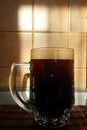A half liter mug of dark beer