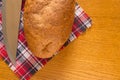 Half loaf of highbrow with a knife. Royalty Free Stock Photo