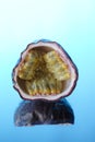 Half of a maracuya (passion fruit) on a mirror