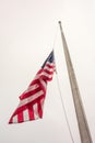 Half mast American flag concept a symbol of the United States Royalty Free Stock Photo