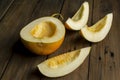 Half a melon and a few pieces are cut into slices. ON the table is a melon without seeds cut. Royalty Free Stock Photo