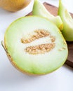 Half melon and sliced pieces of melon on white background Royalty Free Stock Photo