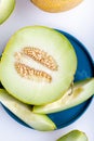 Half melon and sliced pieces of white background. Royalty Free Stock Photo
