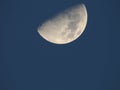Half moon against blue sky Royalty Free Stock Photo