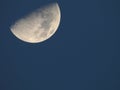 Half moon against blue sky Royalty Free Stock Photo