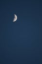 Half moon on a blue evening sky Royalty Free Stock Photo