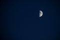 Half moon in the blue night sky Royalty Free Stock Photo