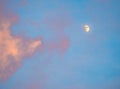 Half Moon on a Blue Sky with Clouds Royalty Free Stock Photo