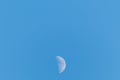 Half moon on a clear blue sky Royalty Free Stock Photo