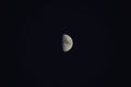 Half moon in a dark black sky Royalty Free Stock Photo