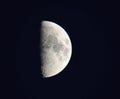 Half Moon early evening visible craters. Royalty Free Stock Photo