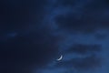 half moon floating on dark blue sky in twilight background Royalty Free Stock Photo