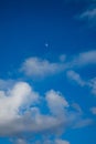 Daytime Half Moon Amongst the Fluffy Clouds Royalty Free Stock Photo