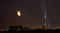 Half moon over TV tower and city in summer night Royalty Free Stock Photo