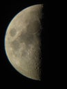 Half moon seen through a small telescope