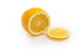 Partly sliced Meyer lemon on a white background