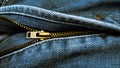 half-open zipper, in blue jean pants.  its function is to connect the two sides of the fabric. Royalty Free Stock Photo