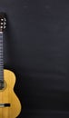 Half of a orange acoustic guitar on black background. Royalty Free Stock Photo