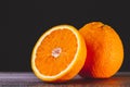 Half an orange. Two halves of fruit on a wooden table. Copyspace. Royalty Free Stock Photo