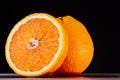 Half an orange. Two halves of fruit on a wooden table. Copyspace. Royalty Free Stock Photo