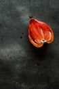 Half Organic Bull's Heart Heirloom Tomato on Rustic Dark Wooden