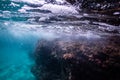 Half over half underwater shot on a beautiful bay in Palma de Mallorca, Coast line water line macro shot, underwater photography Royalty Free Stock Photo