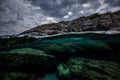 Half over half underwater shot on a beautiful bay in Palma de Mallorca, Coast line water line macro shot, underwater photography Royalty Free Stock Photo