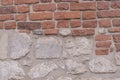 Half painted brick wall. Red brick wall and half-ruined white stucco, architecture close-up abstract background Royalty Free Stock Photo