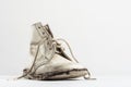 A half pair of old baby shoes on white Royalty Free Stock Photo
